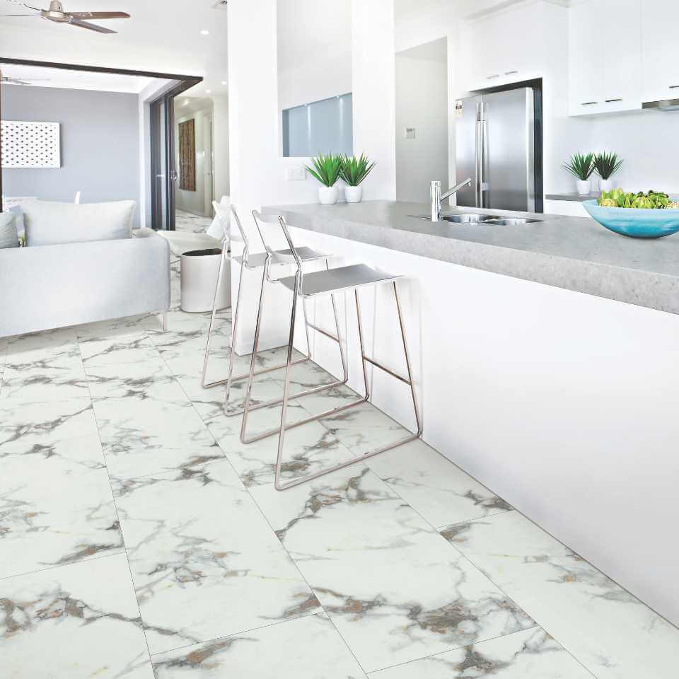 A kitchen with a marble floor